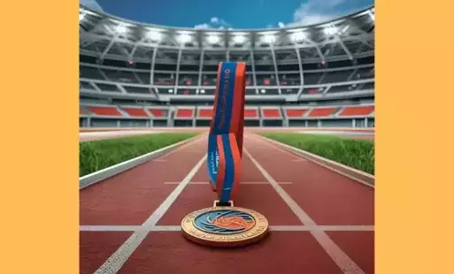 Na zdjęciu medal na bieżni sportowej